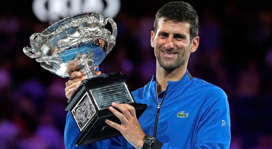Novak Djokovic holds Australian Open trophy 2019.